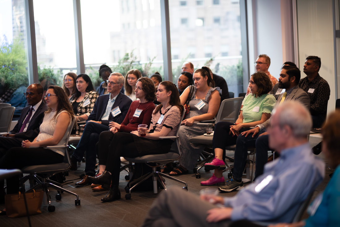 Guests listening to a speaker during the 2024 Networking for a Cause event