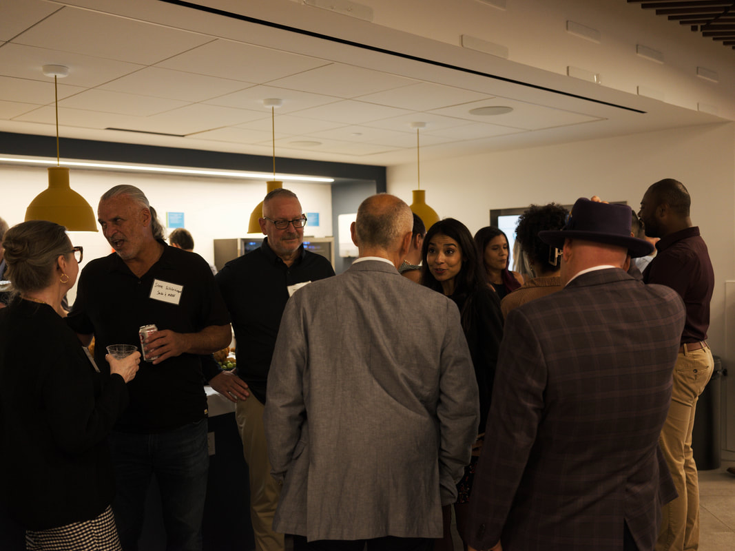 Professionals meeting and talking during Networking for a Cause in New York City