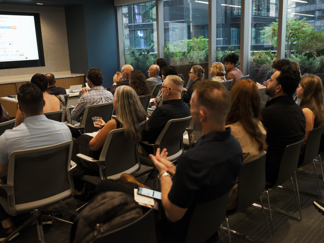 Professionals connecting during the 2025 Networking for a Cause reception