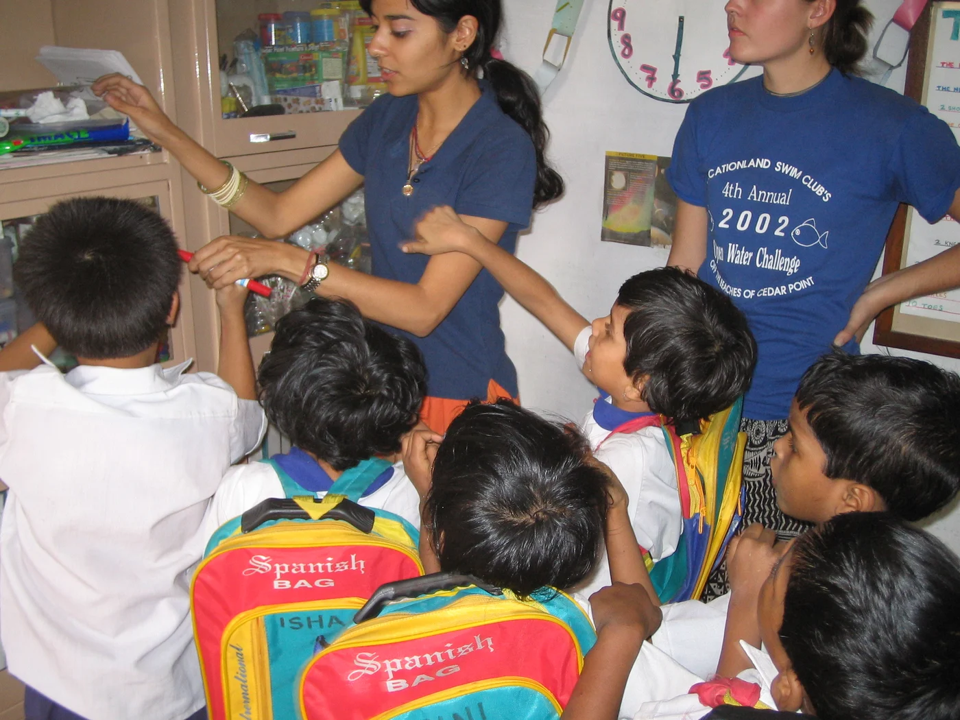 Tanya Pinto helping children during a classroom activity in Kolkata in 2005
