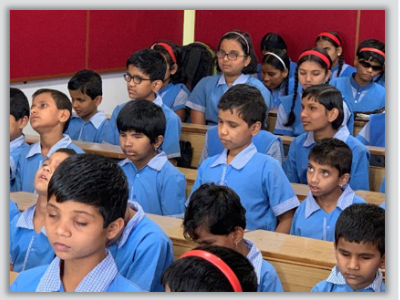 Students in blue uniforms learning at Jagriti School for Blind Girls